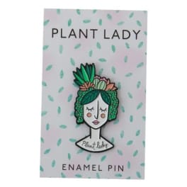 Plant lady enamel pin on a patterned backing card