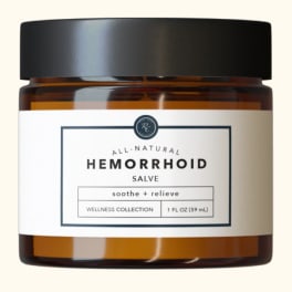 Amber jar of hemorrhoid salve with a black lid and white label