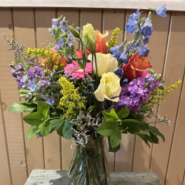 Colorful mixed bouquet in a clear glass vase