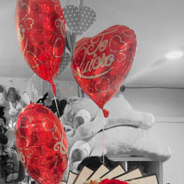 Red rose bouquet with birthday ribbon and heart balloons