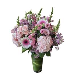 Pink and white mixed bouquet in a tall green vase