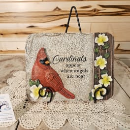 Decorative plaque with a cardinal and flowers on a stand