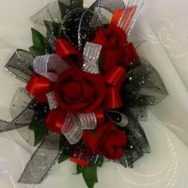 Red rose bouquet with silver and black ribbon accents