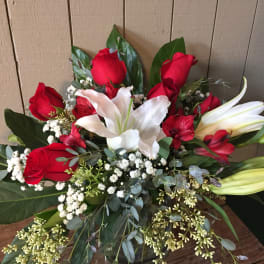 Bouquet of red roses and white lilies with baby's breath