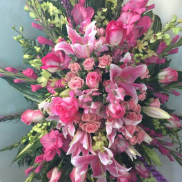 Large pink floral spray with lilies and roses