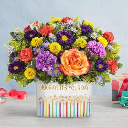 Colorful mixed flower arrangement in a white gift box with a birthday message