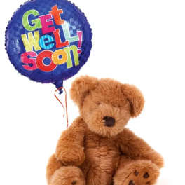 Teddy bear holding a blue "Get Well Soon" balloon