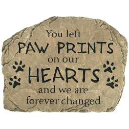 Memorial stone with paw prints and a sympathy message
