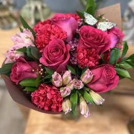 Bouquet of hot pink roses, carnations, and pale pink alstroemeria