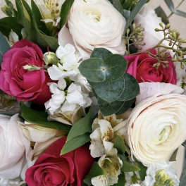 Bouquet of pink and white roses with small white flowers