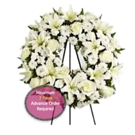 White funeral wreath on a standing easel