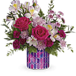 Pink roses and white alstroemeria in a patterned vase