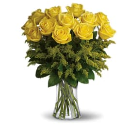 Yellow roses arranged in a clear glass vase