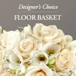 Cream roses and white calla lilies in a floor basket