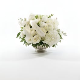 White rose bouquet in a silver vase with cream ribbons