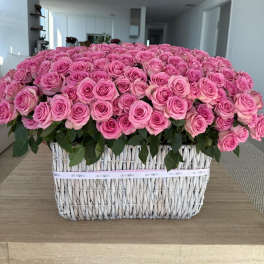 Large basket arrangement of pink roses