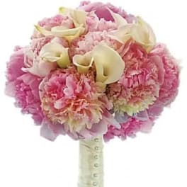 Pink bouquet with cream calla lilies and carnations wrapped in white ribbon