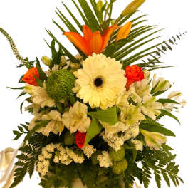 Mixed bouquet with orange lilies, white gerbera daisies, and cream flowers