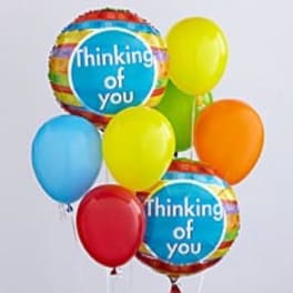 Cluster of colorful balloons, including two "thinking of you" balloons