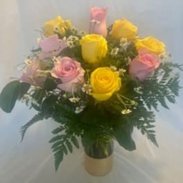 Bouquet of pink and yellow roses in a vase