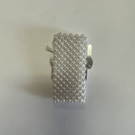 Silver beaded rectangular accessory with a small white accent