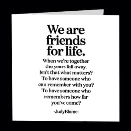 White quote card with black text about friendship