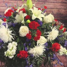 Large red, white, and purple floral spray with lilies and carnations