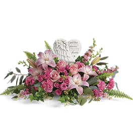 Pink floral sympathy spray with a heart-shaped angel plaque