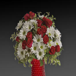 Red roses and white daisies arranged in a red glass vase