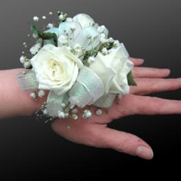 White rose wrist corsage with baby's breath and silver ribbon