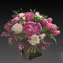 Pink and white bouquet in a clear glass vase