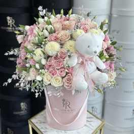 Pink and white rose bouquet with a teddy bear in a pink hatbox