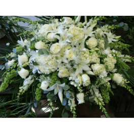 Large white floral spray with lilies and roses