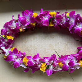 Oval floral lei with purple orchids and yellow roses