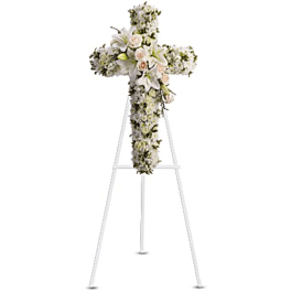 White floral cross on a metal stand