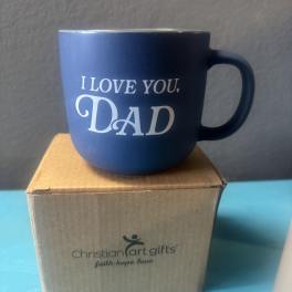 Blue mug with "I LOVE YOU, DAD" text on a cardboard box