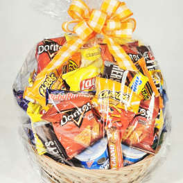 Basket of assorted snack bags wrapped in clear cellophane with a yellow ribbon
