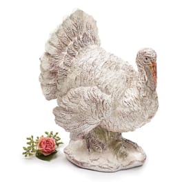 Decorative turkey figurine with a small pink rose accent
