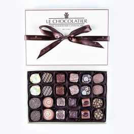 Box of assorted chocolates with a ribbon-tied lid