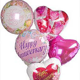 Cluster of heart-shaped and round anniversary balloons in pink and white