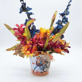 Colorful floral arrangement in a decorated ceramic pot