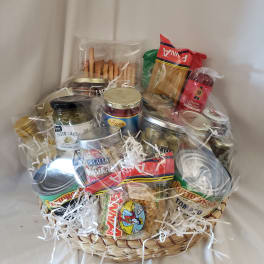 Gift basket with pasta, sauces, olives, and salami
