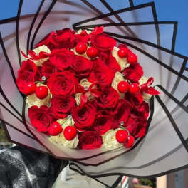 Bouquet of red and white roses wrapped in black-edged paper