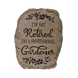Decorative stone plaque with the words "I'm not retired, I'm a professional gardener"
