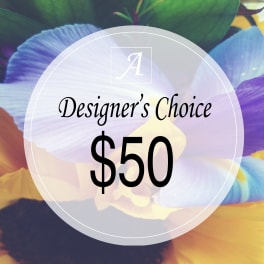 Designer’s Choice $50 floral arrangement graphic over colorful petals