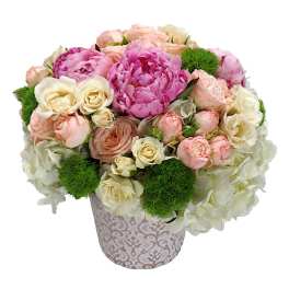 Pink and cream bouquet in a patterned vase