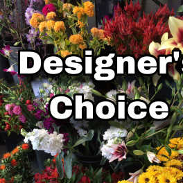 Flower shop display with mixed bouquets and large "Designer’s Choice" text