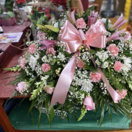 Pink Pasture with Baby Breath with Pink Bow Casket Spray