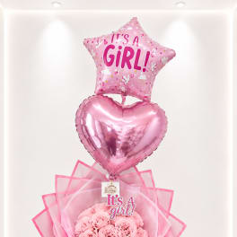 Pink baby shower bouquet with a star balloon, heart balloon, and roses