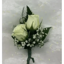 Two white rose buds with baby's breath in a small hand-tied bouquet